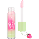 Pink and green lip cream with strawberry charm on a white background